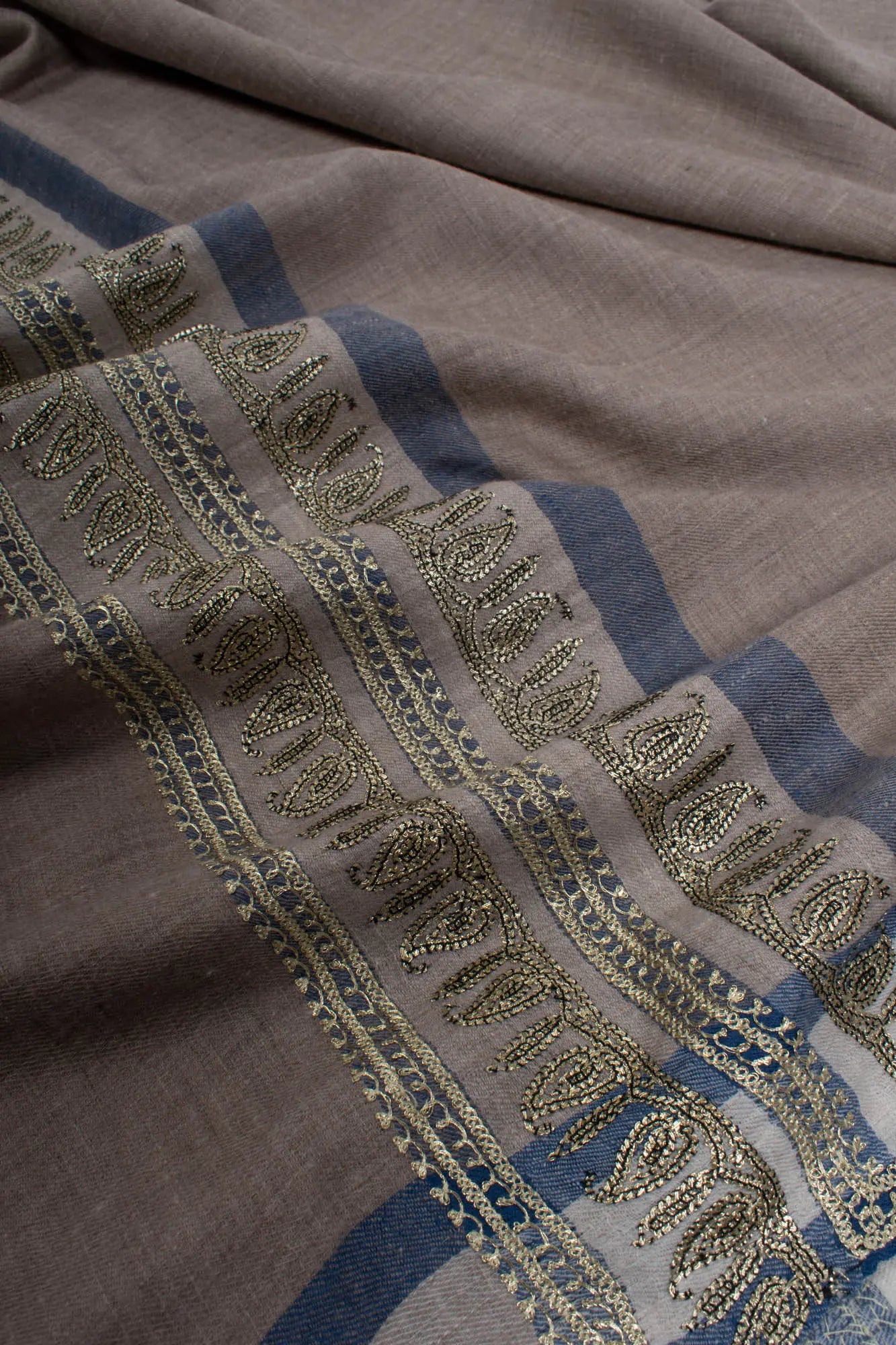 Gray Pashmina Shawl embellished with artistic Water Gold Tilla Embroidery. Shahkaar