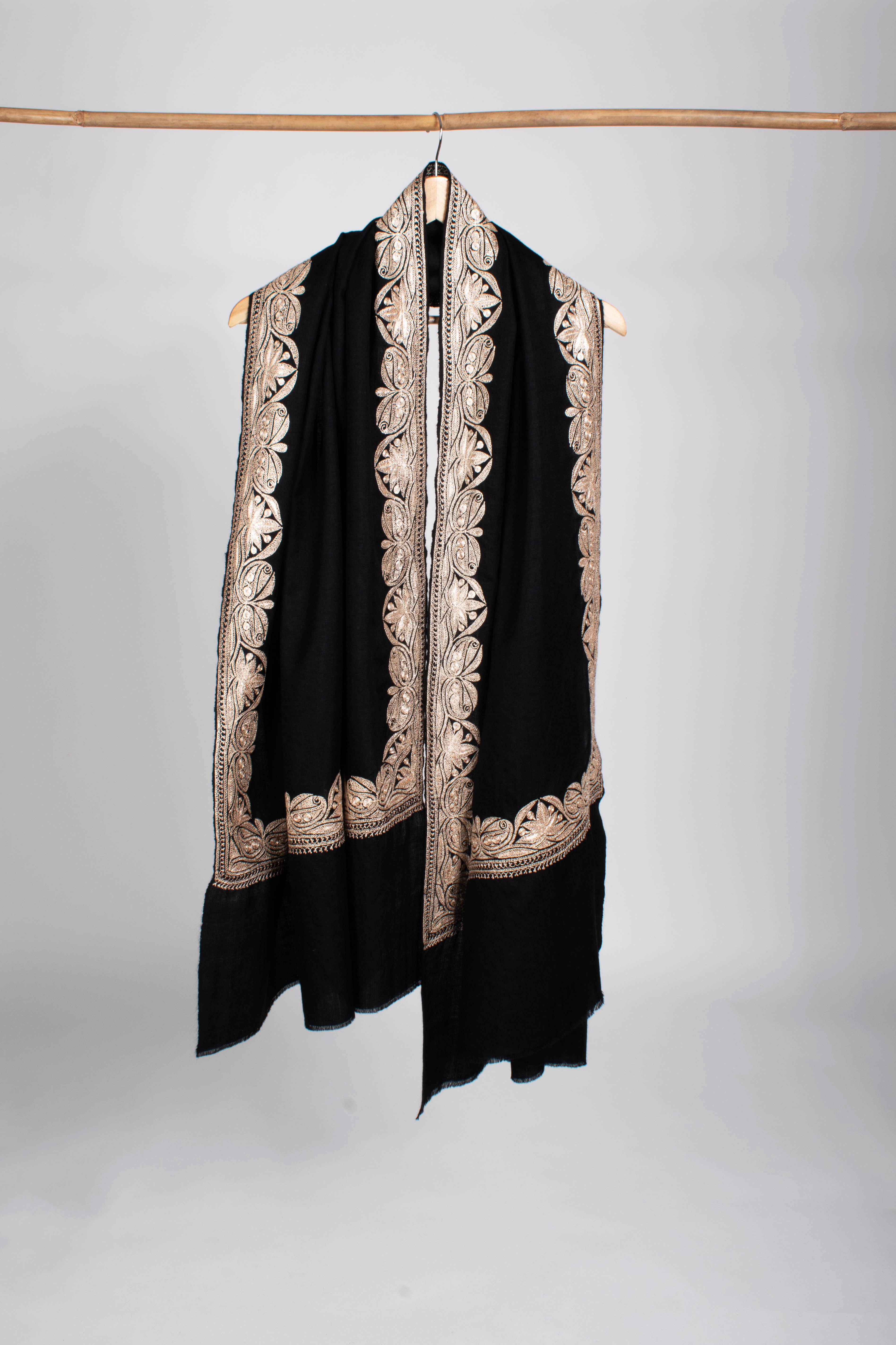 Black Pashmina Wrap adorned with Water Gold Zari Embroidery.
